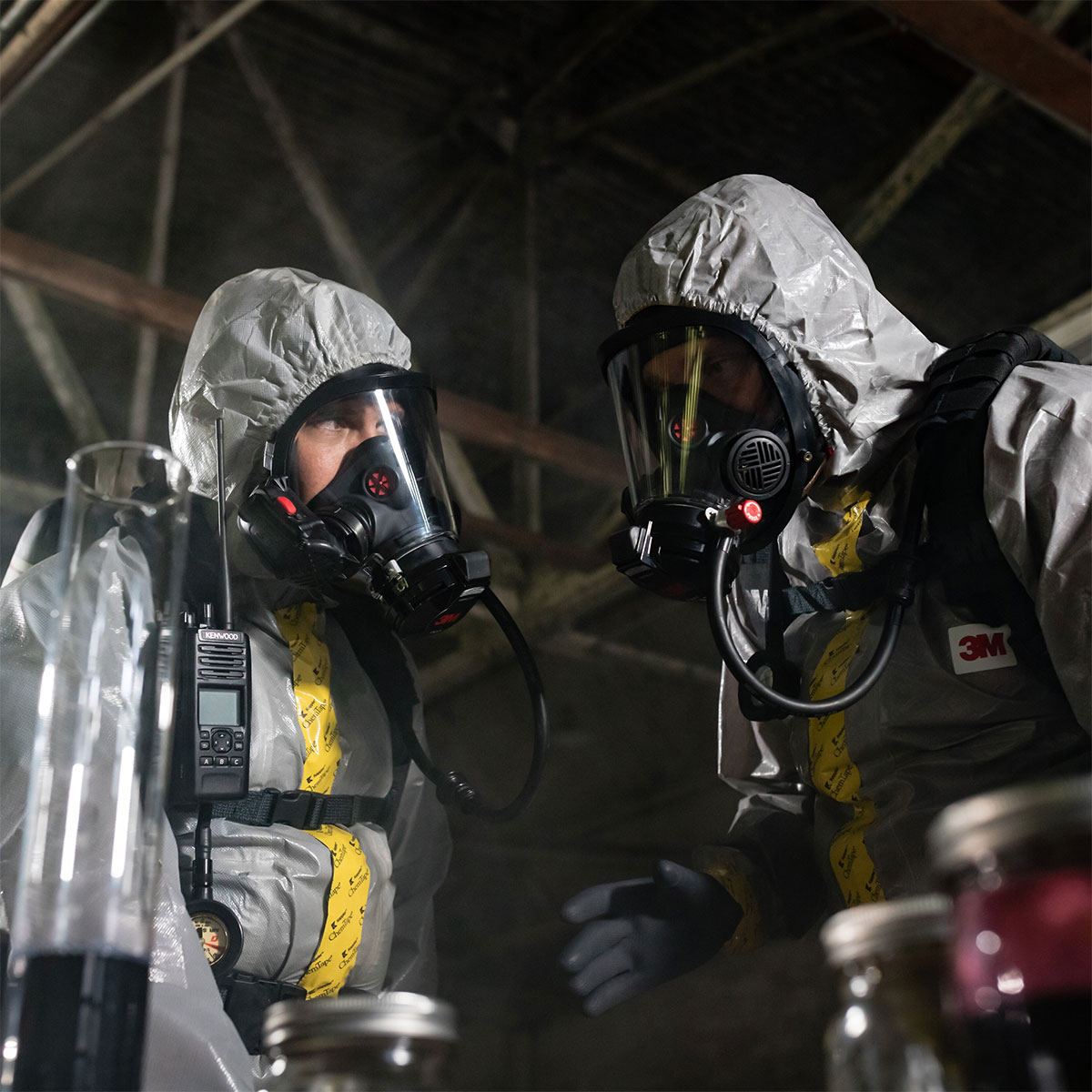 Crime Scene investigators in a clandestine lab wearing protective apparel and 3M Scott SCBA respirators and face masks